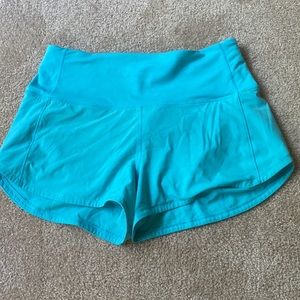 Electric turquoise speed up shorts from Lulu Lemon. Perfect condition